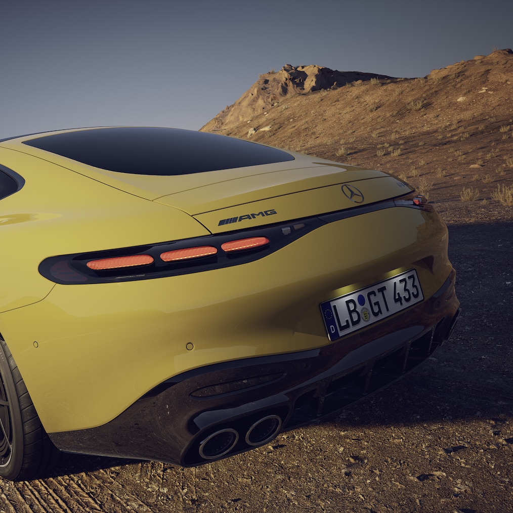 Driving shot of the Mercedes-AMG GT 43 Coupé, seen from the rear end with extended rear wing.