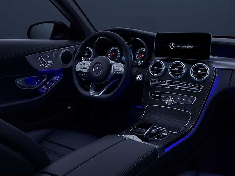 The interior of the Mercedes-Benz C-Class Cabriolet with ambient lighting.