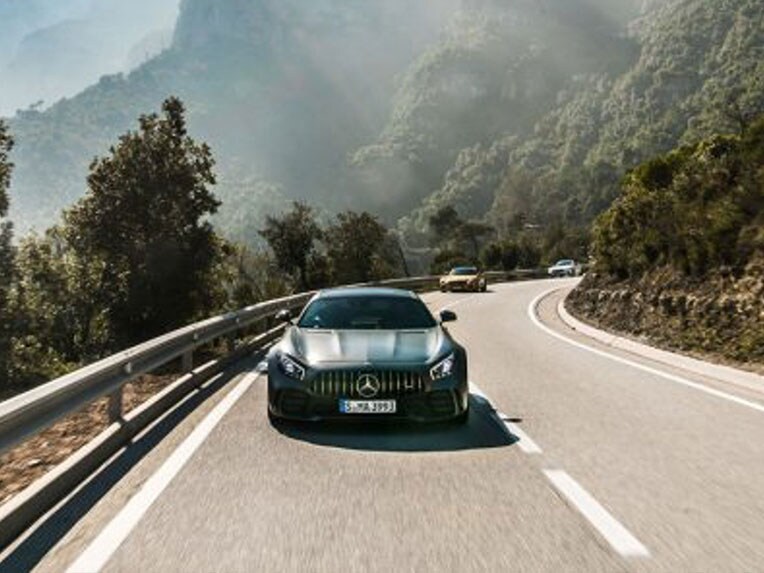 Front view of a Mercedes-AMG GT R on the road.