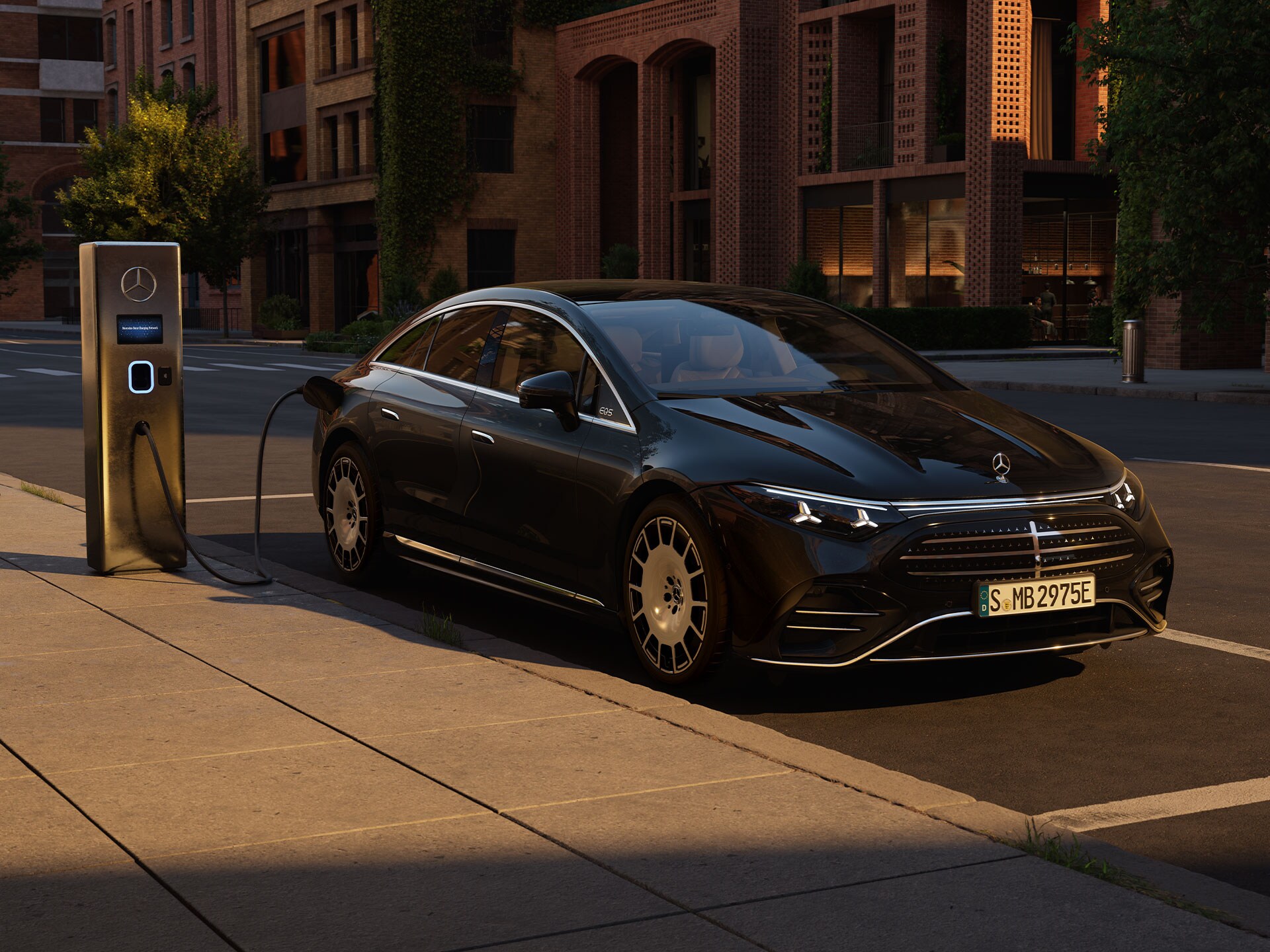 The new all-electric EQS from Mercedes-Benz charging in front of a public charging station.