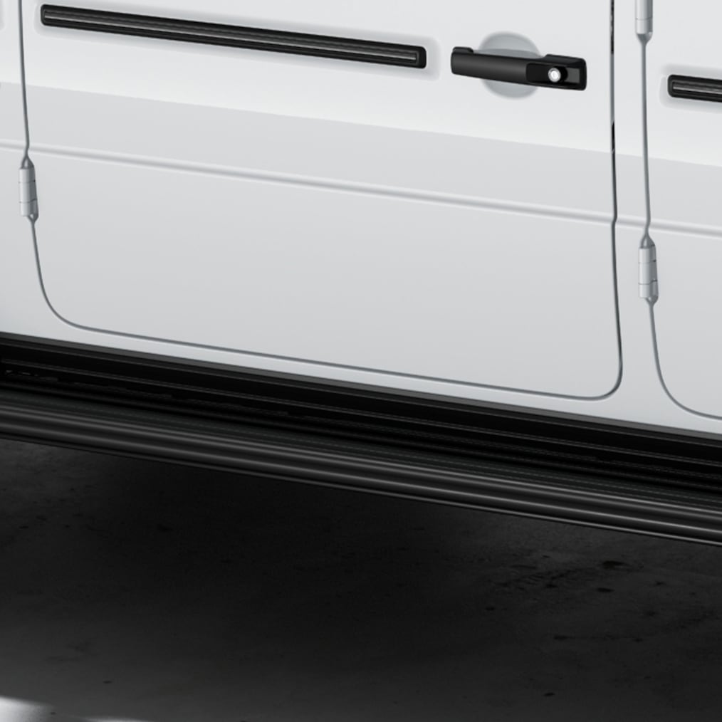 Side rear view (from above) of a Mercedes-Benz G 450 d with MANUFAKTUR running boards in black.