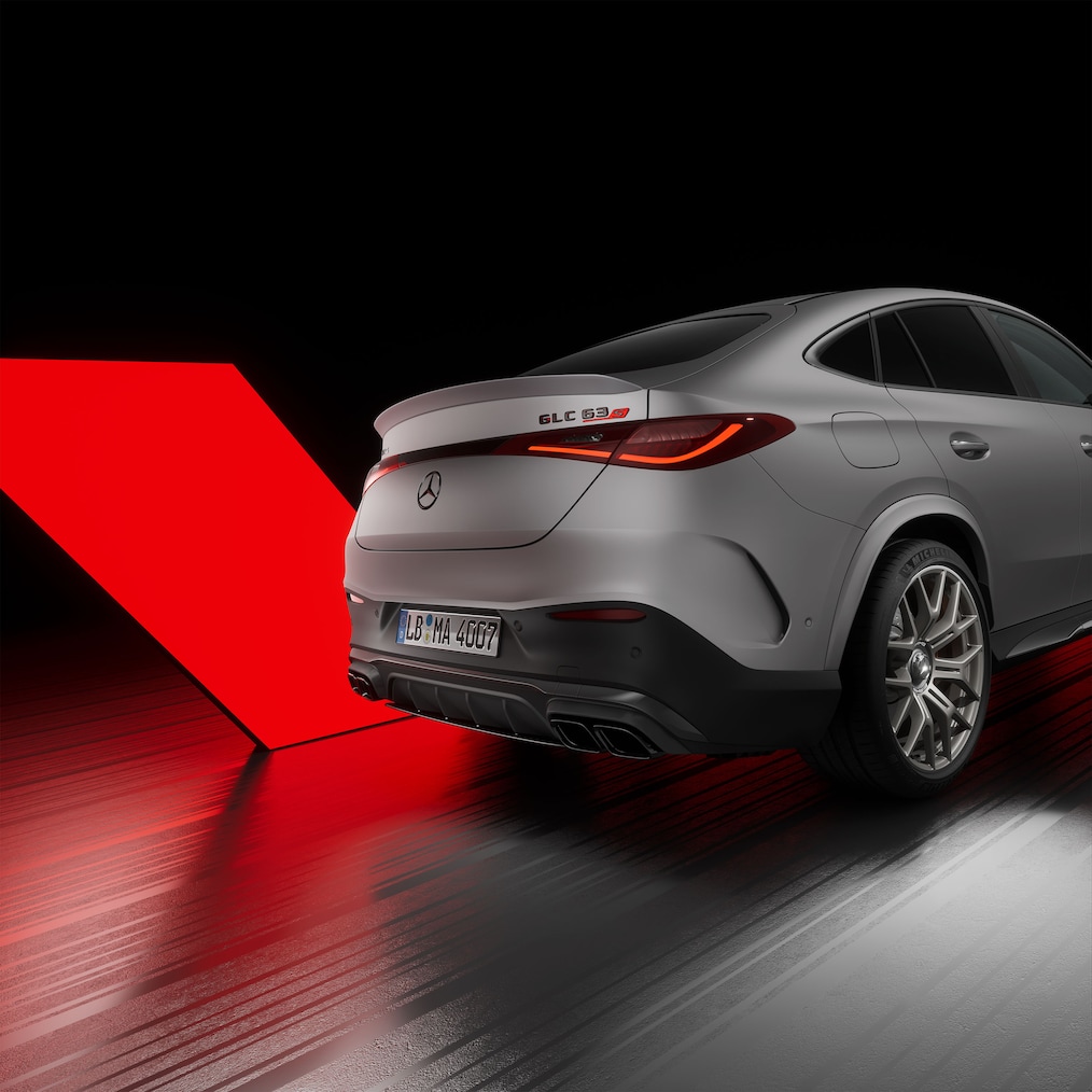 Close-up view of AMG door sills illuminated with "AMG" lettering.