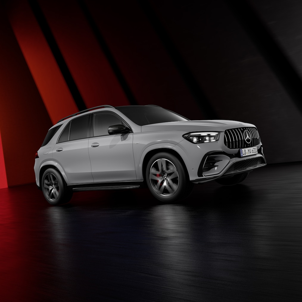 Dynamic view of a Mercedes-AMG GLE SUV (driving shot) or all three models standing next to each other.