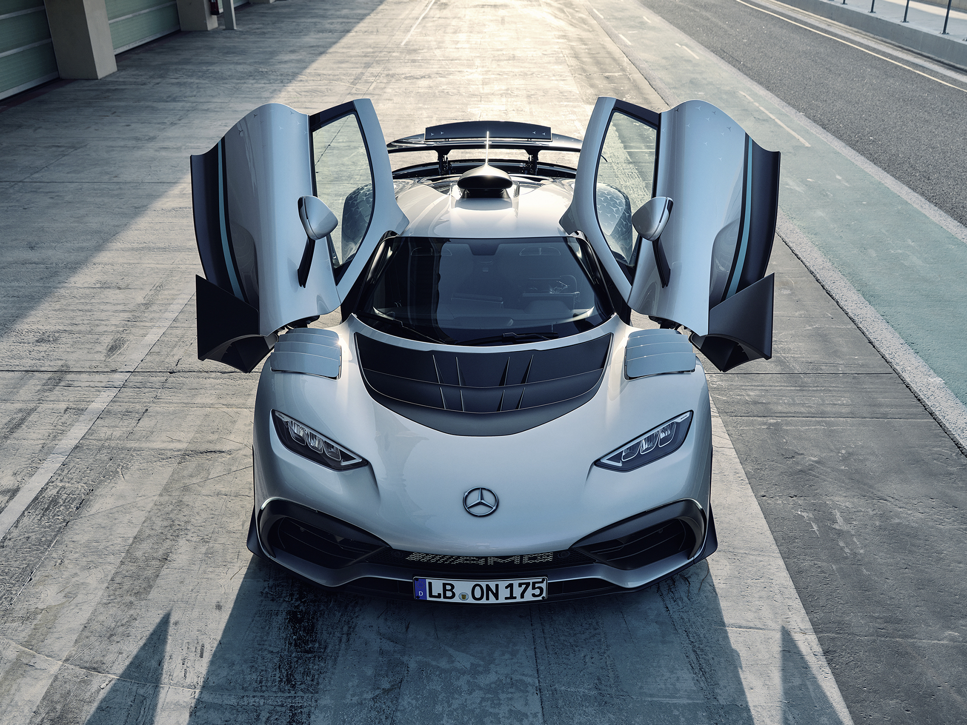 Exterior | ONE | Mercedes-AMG Front view of the Mercedes-AMG ONE with the doors open.