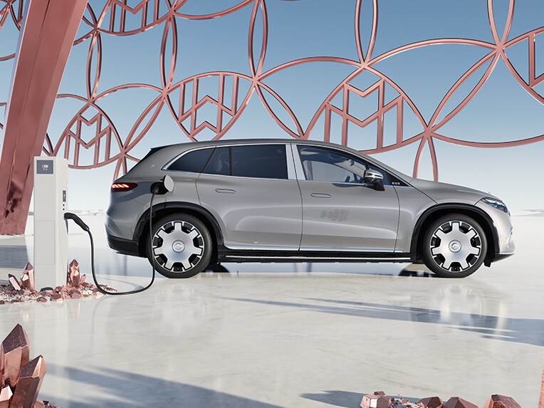 Mercedes-Maybach EQS SUV charging at an IONITY quick charge station.