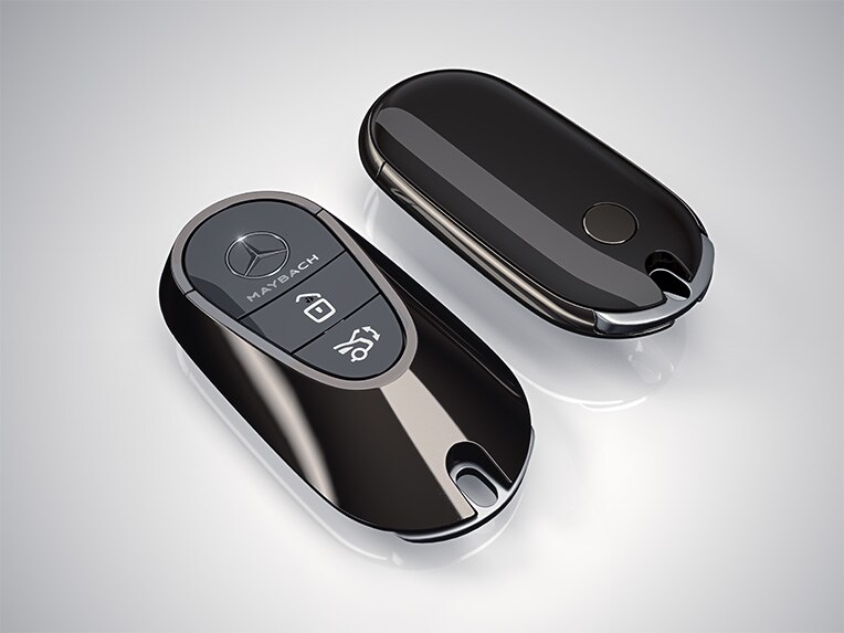 Vehicle key in high-gloss black with high-sheen chrome trim frame of the Mercedes-Maybach EQS SUV.