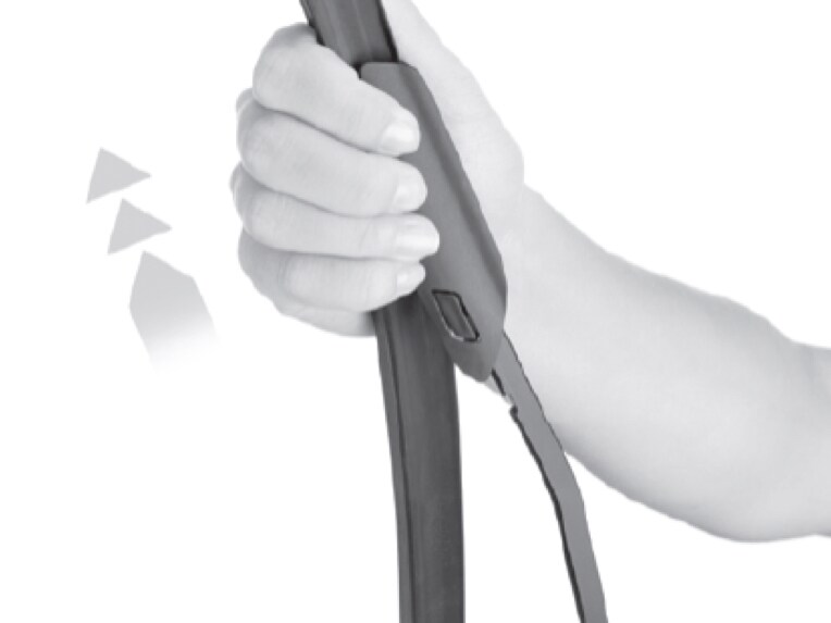 Press the release button and remove the wiper blade from the wiper arm.