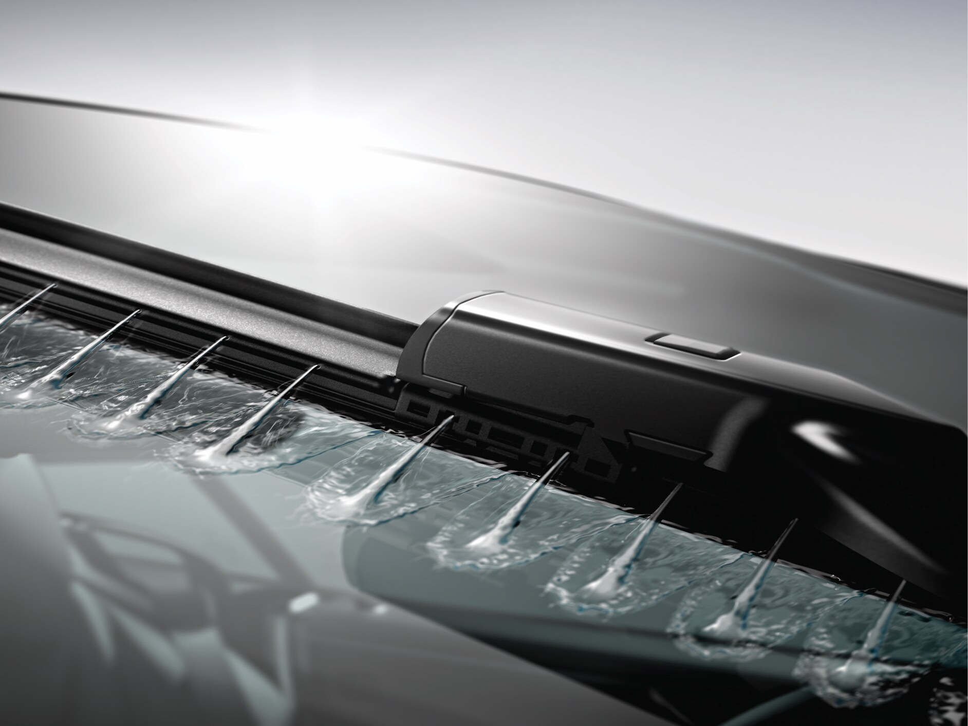 Wiper fluid is sprayed onto the windscreen