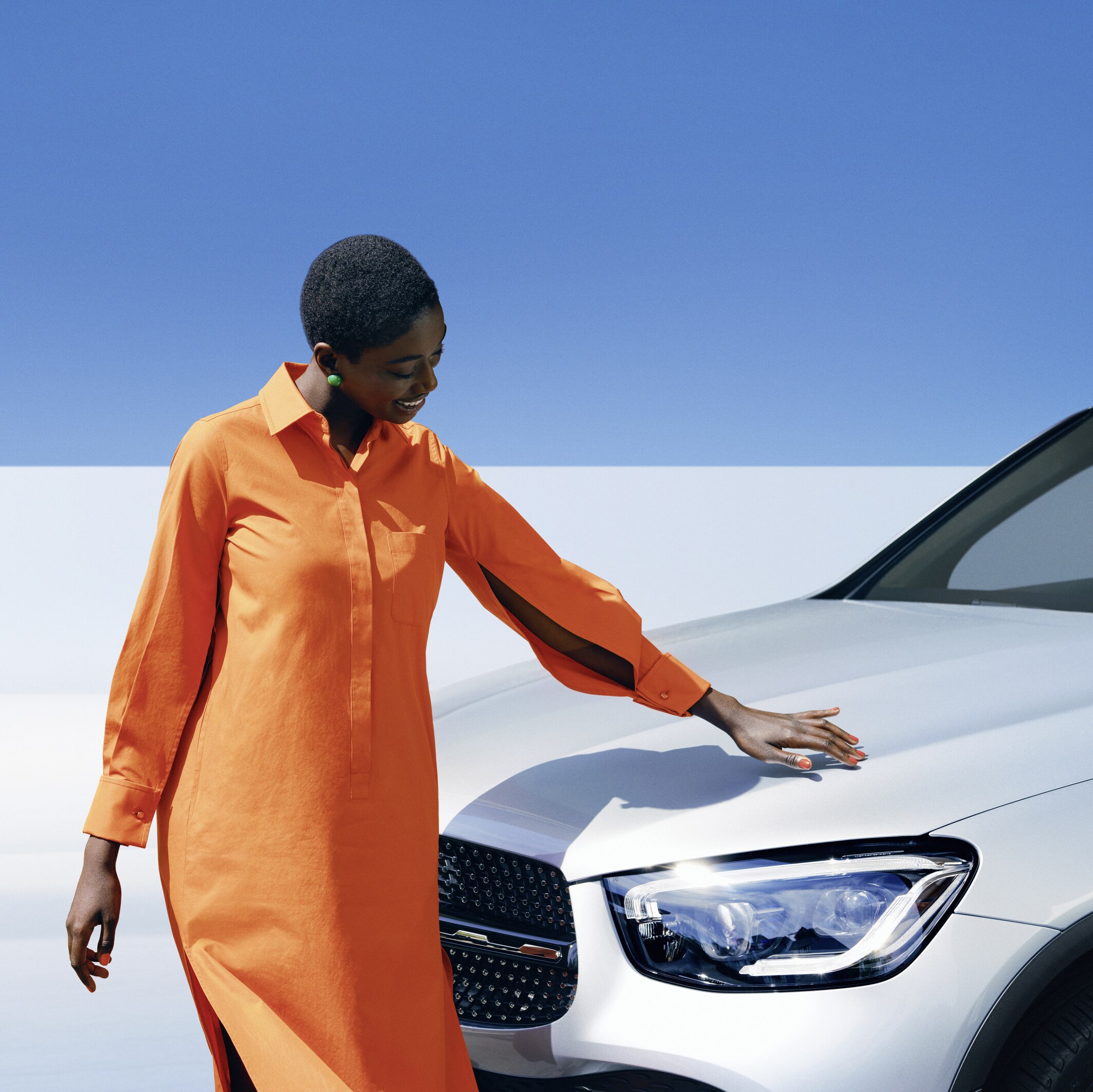 A woman inspecting her Mercedes-Benz