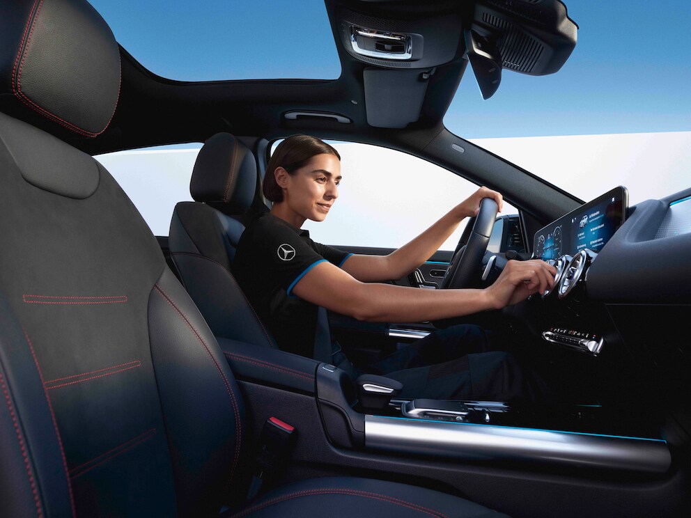 A Mercedes-Benz technician checking the air conditioning system.