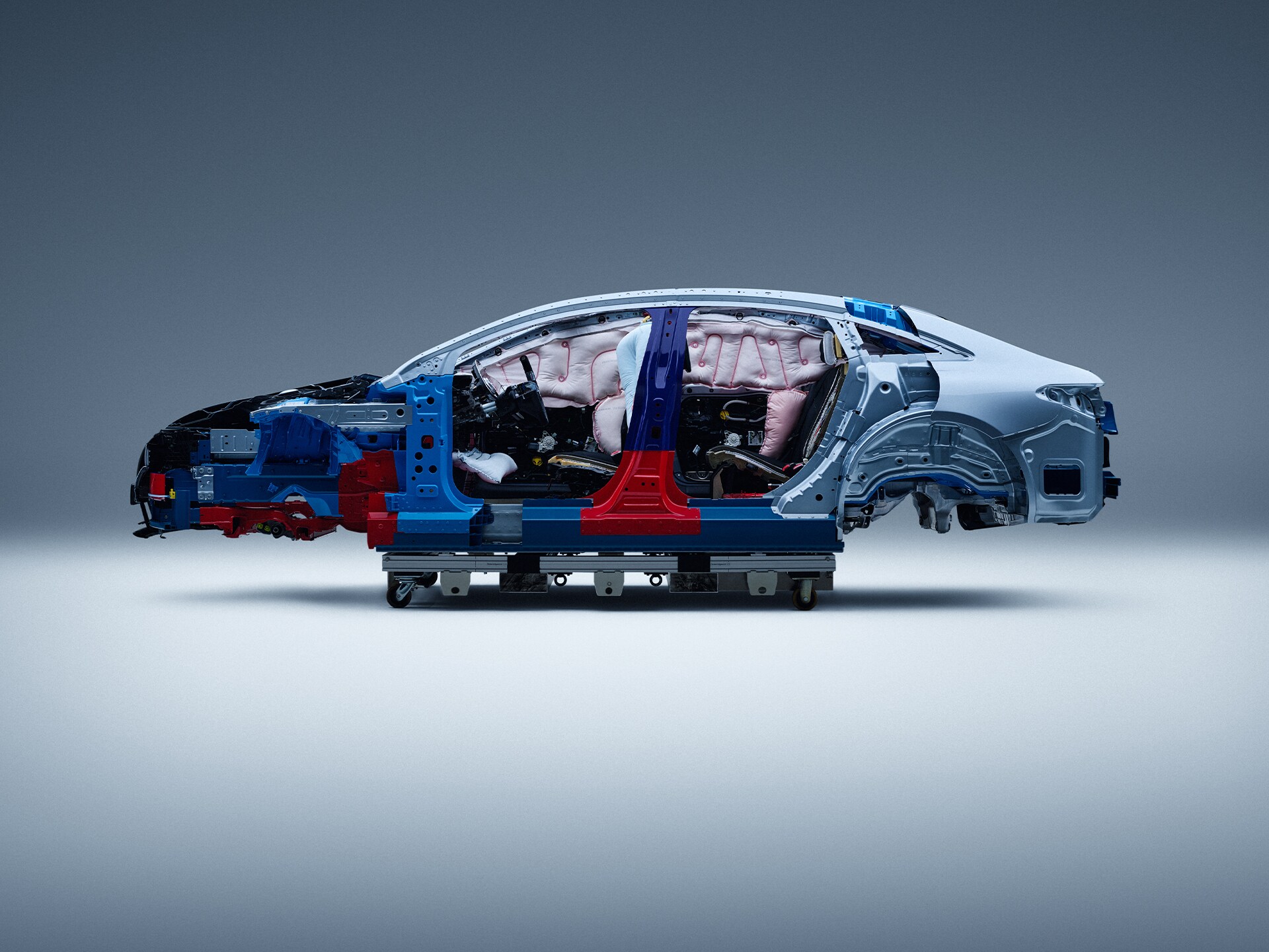 Side view of a partially disassembled Mercedes-Benz car for safety research.
