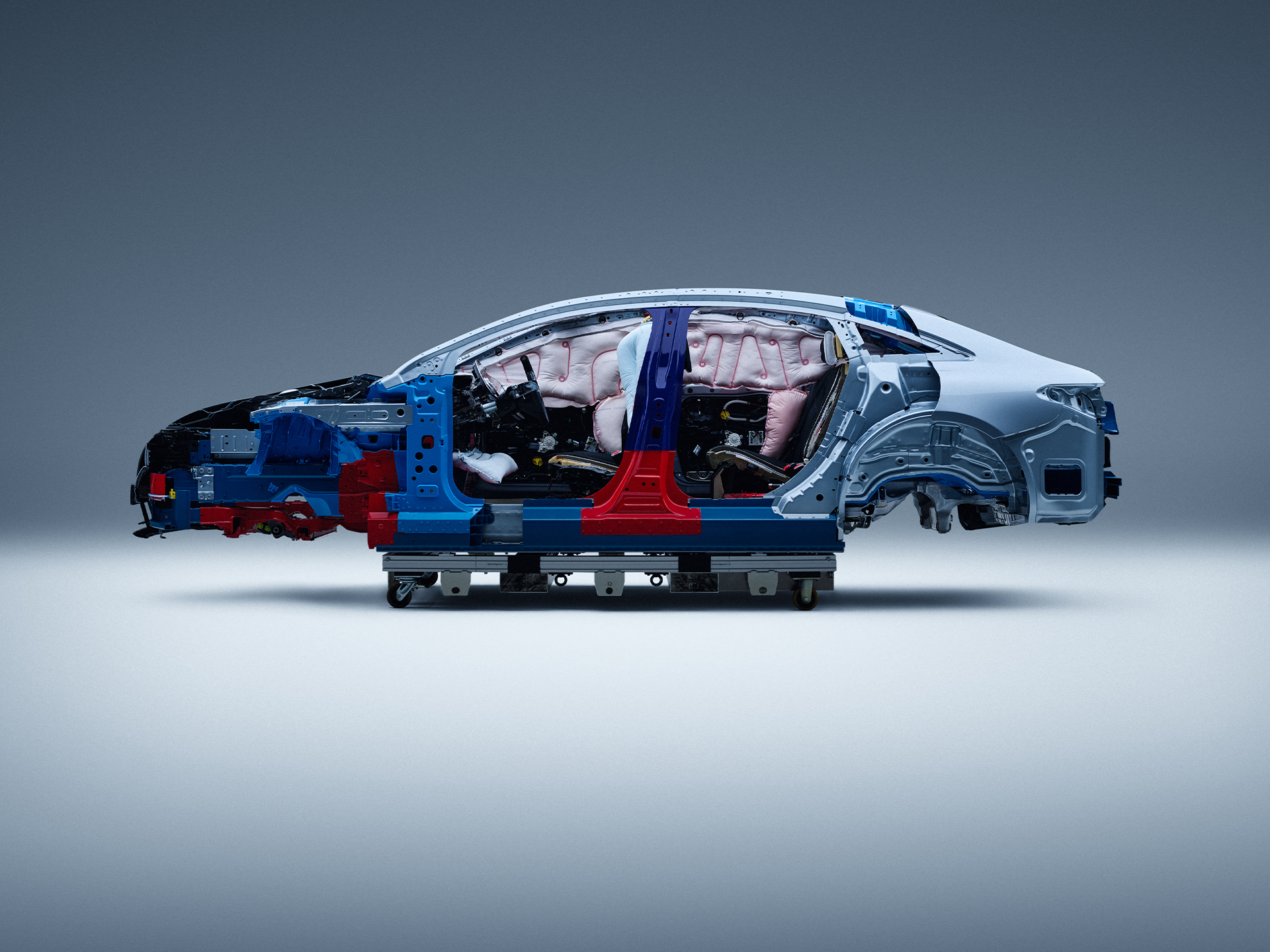 Safety | Mercedes-Benz Side view of a partially disassembled Mercedes-Benz car for safety research.