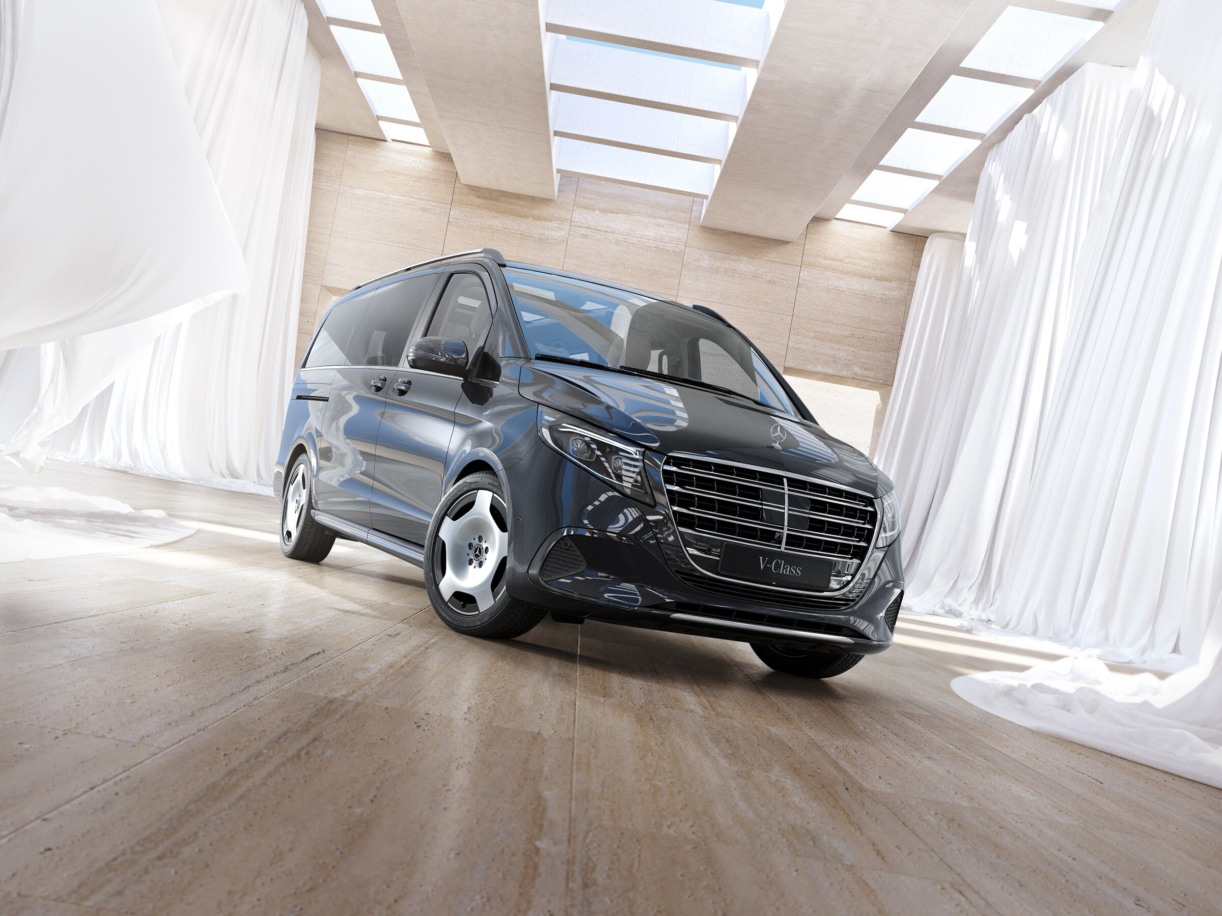 Mercedes-Benz V-Class passenger van positioned in bright modern interior with skylights