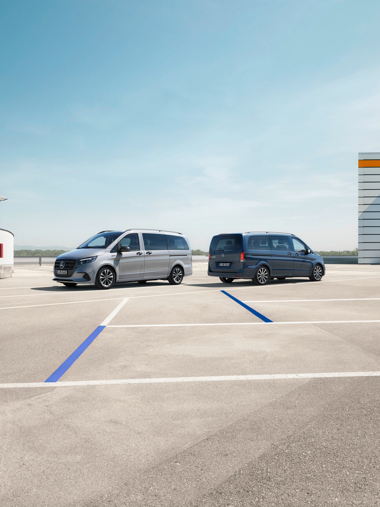 The eVito Tourer and Vito Tourer standing in a parking space.