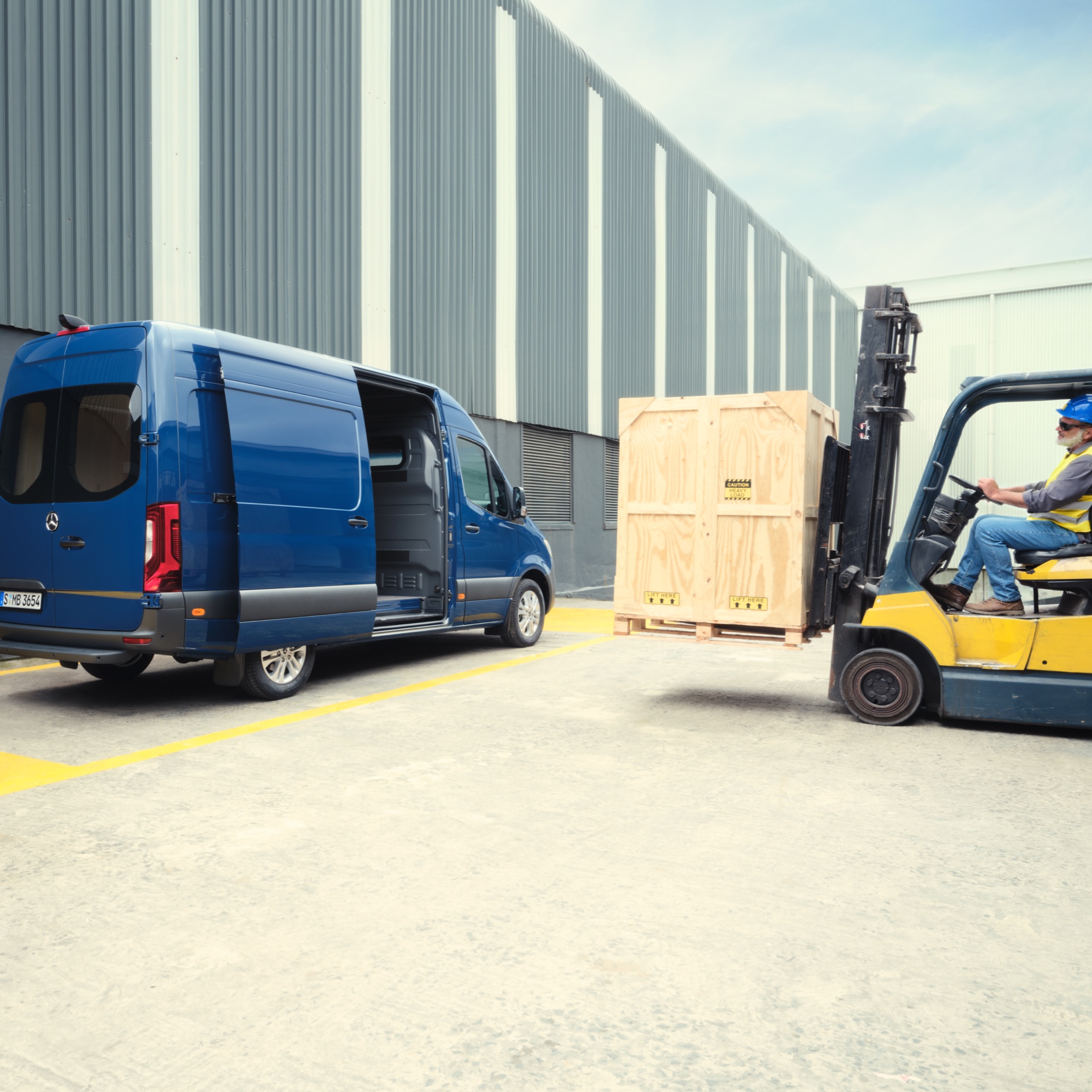 Vehicle Characteristics | Sprinter | Mercedes-Benz The Mercedes-Benz Sprinter Panel Van is being loaded by a fork-lift truck.