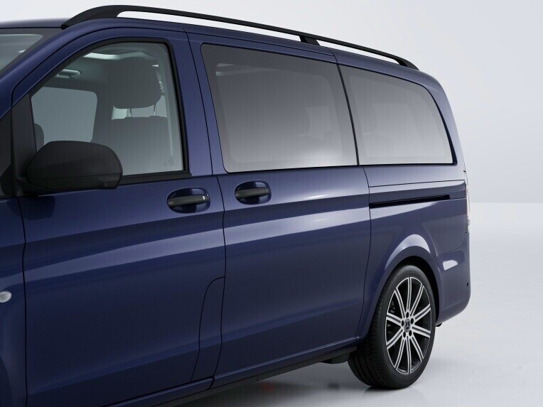 The sliding door on the left-hand side offers additional access to the vehicle.